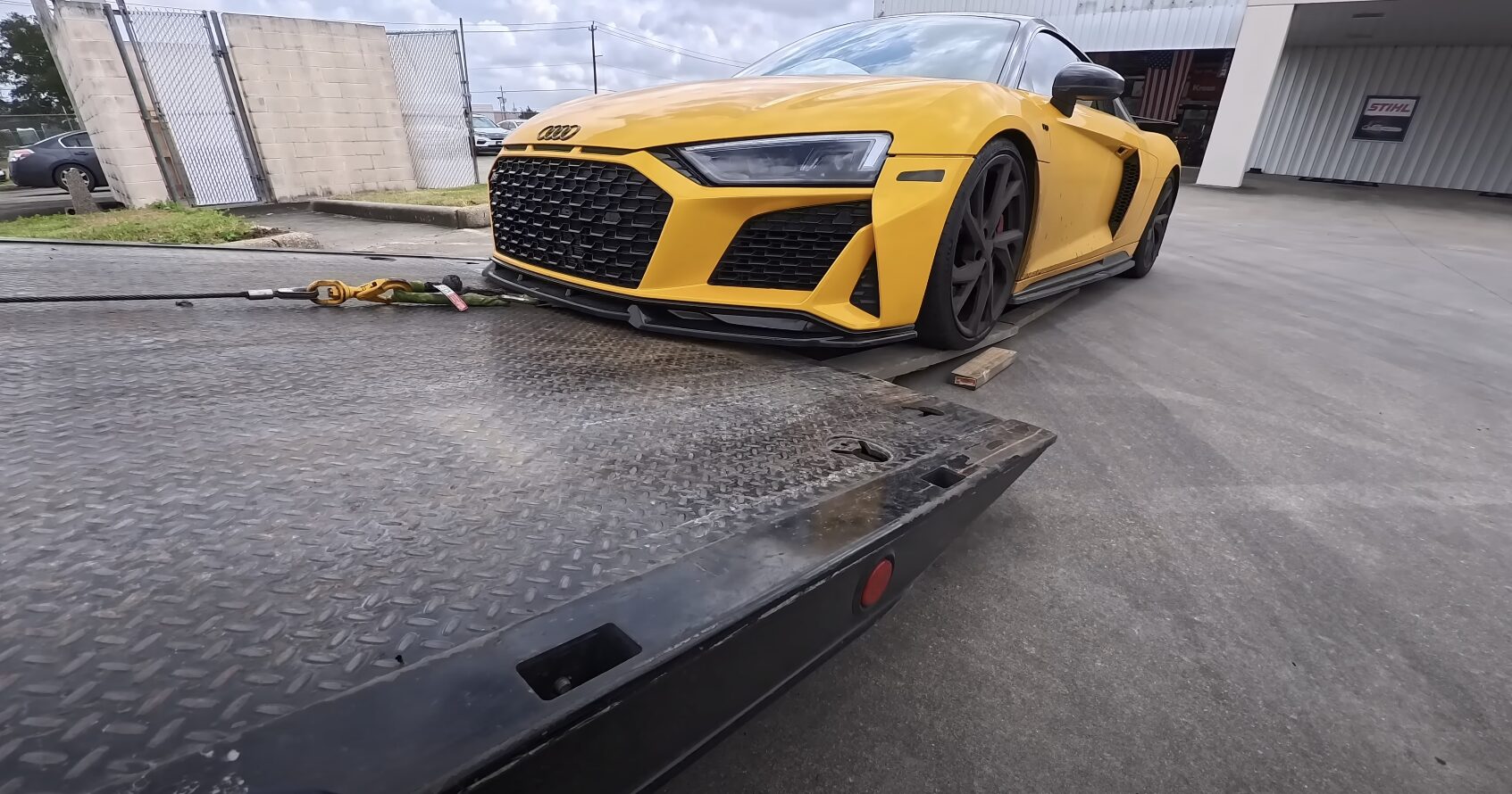 Flatbed Towing - Safe Transport for All Vehicle Types Flatbed tow truck safely loading luxury vehicle for damage-free transport