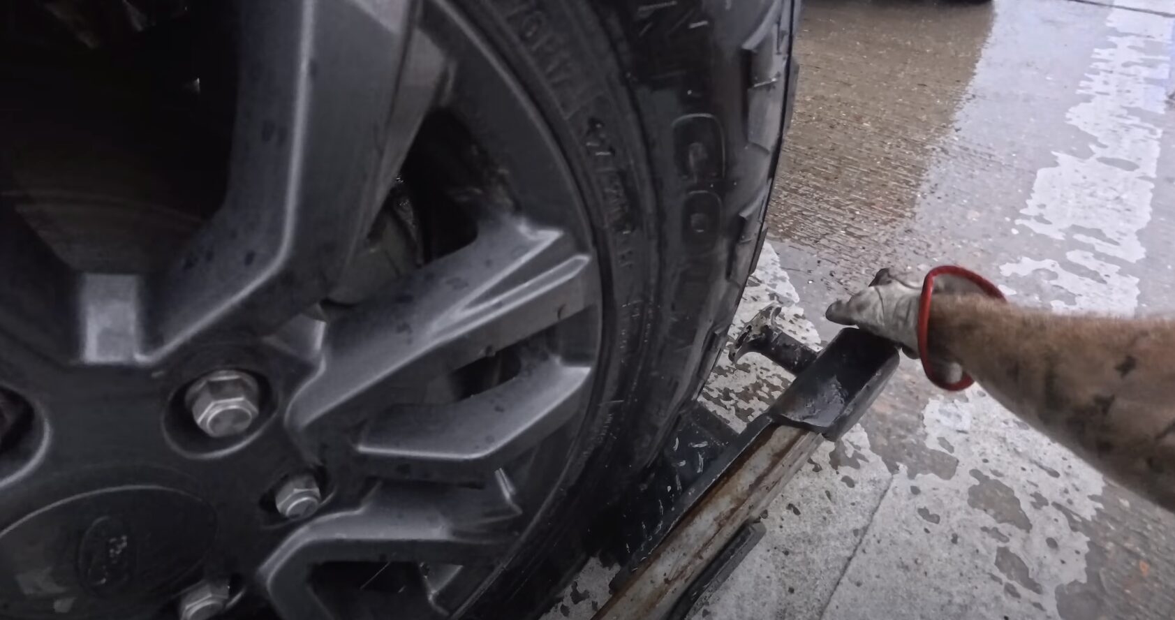 Professional Towing Equipment - Safe and Efficient Vehicle Recovery Tow truck operator using professional tools for vehicle recovery and repair